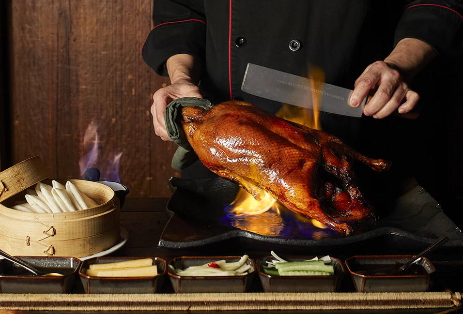 Flaming duck presentation at Hutong New York